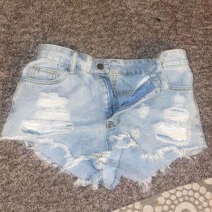 Light washed, ripped, jean shorts.